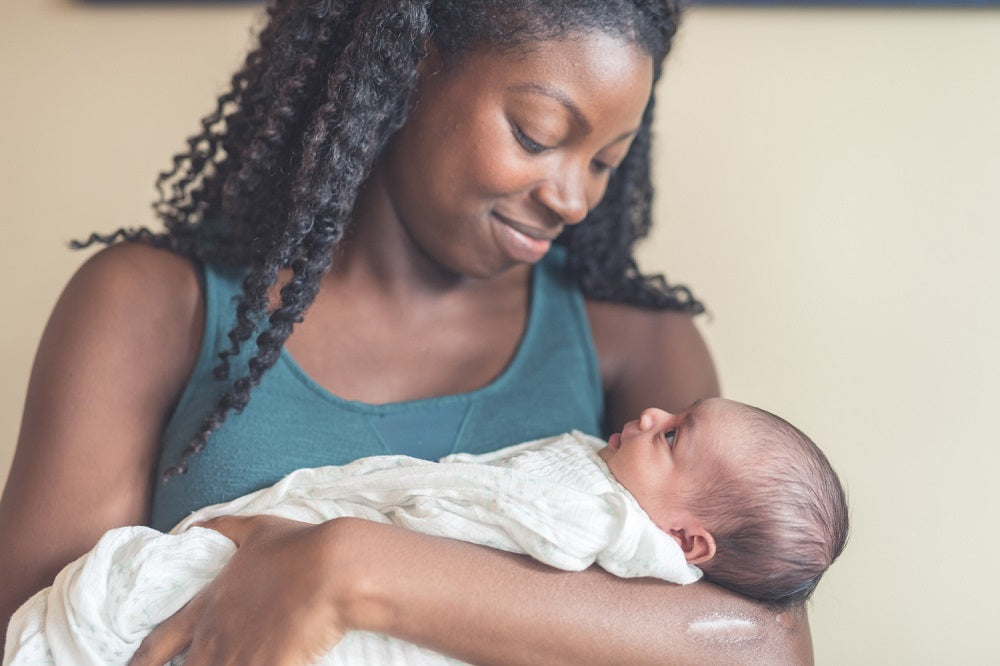 Mom Holding Newborn Baby