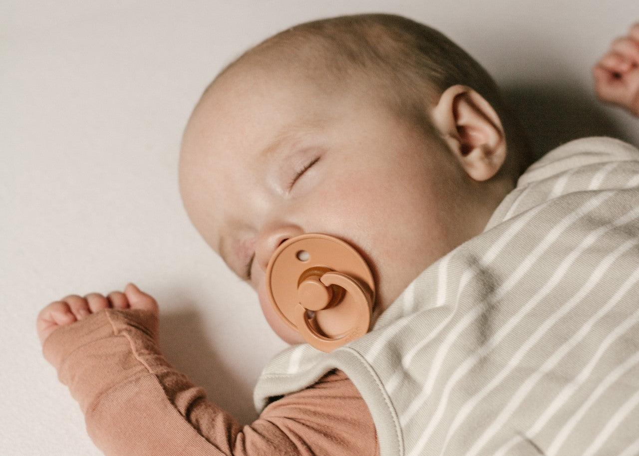 Baby sleeping with pacifier